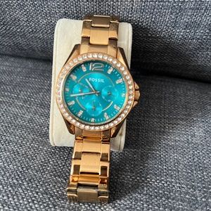 Gold Fossil watch with turquoise face